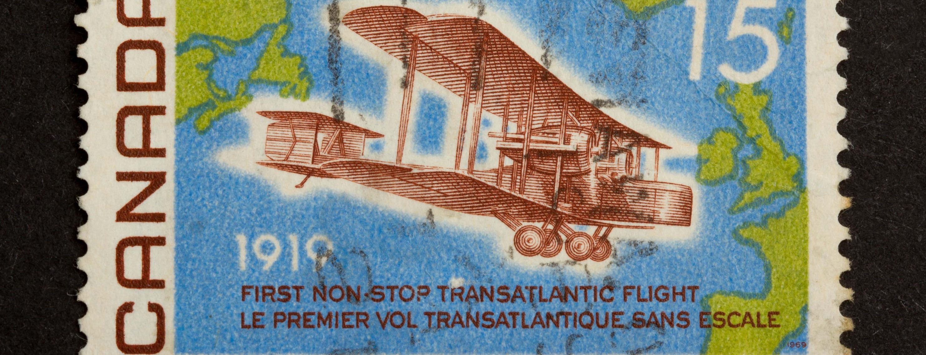 CANADA - CIRCA 1980: Stamp printed in Canada shows a world map and a airplane (1919), circa 1980